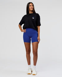 Woman wearing Archive FLXCotton Oversized Tee - Black-Electric Indigo | Model:Rhiley | Size:XS | Thumbnail Index: 8