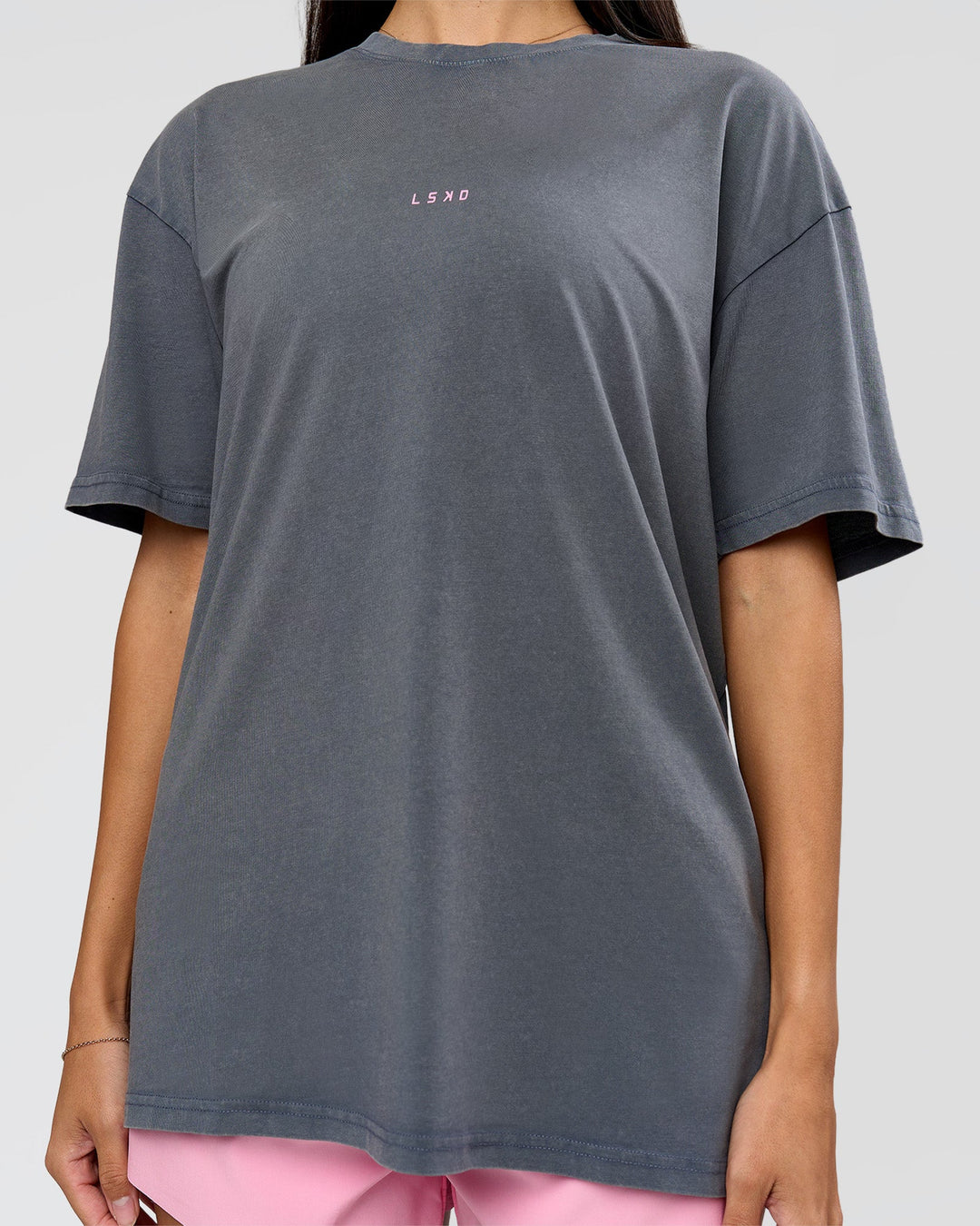 Woman wearing Built On Values FLXCotton Oversized Tee - Dark Storm Washed-Pink Rose | Model:Rhiley | Size:XS - view 14