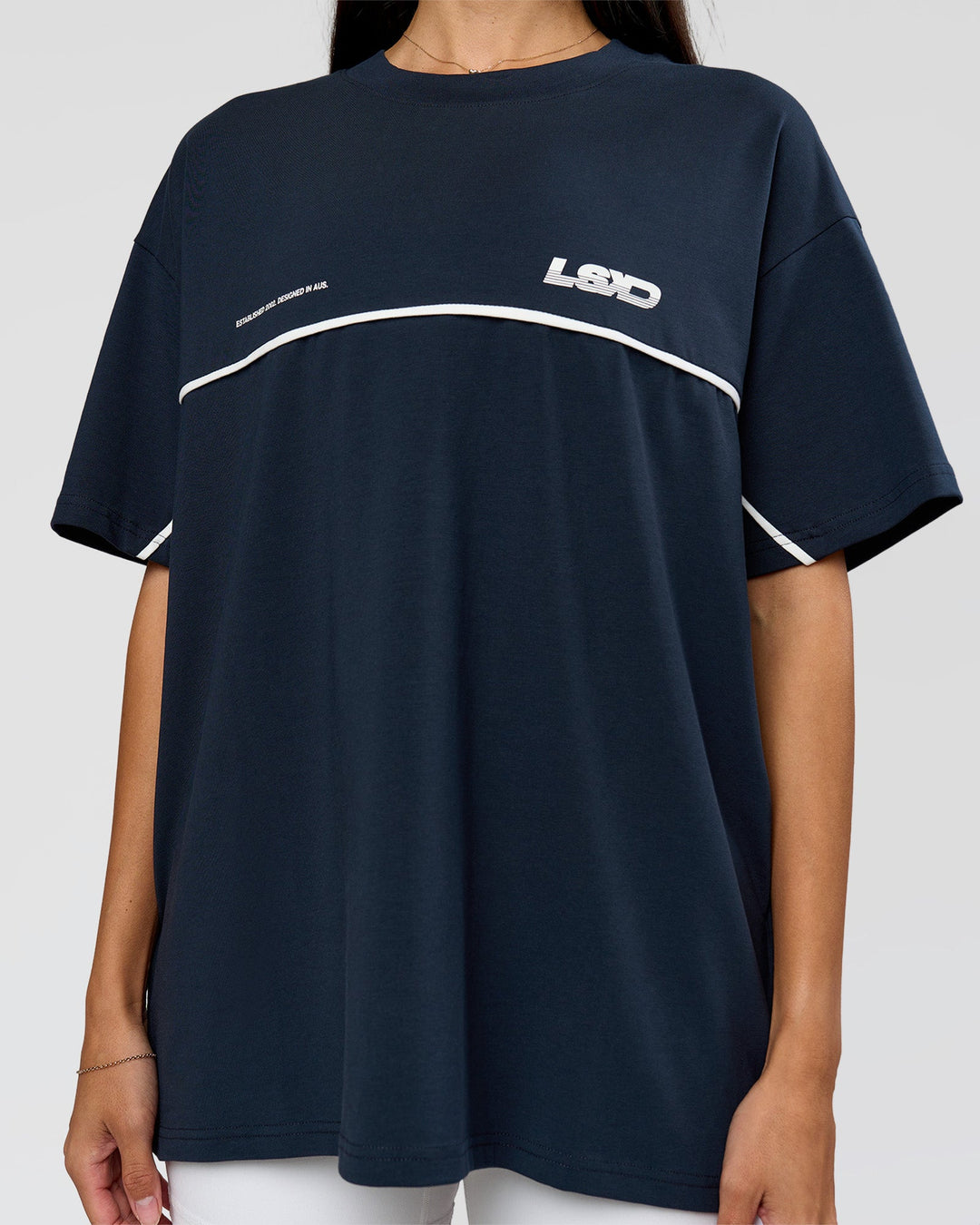 Woman wearing Inline Heavyweight FLXCotton Oversized Tee - Midnight Navy-White | Model:Rhiley | Size:XS - view 4