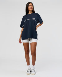 Woman wearing Inline Heavyweight FLXCotton Oversized Tee - Midnight Navy-White | Model:Rhiley | Size:XS | Thumbnail Index: 12