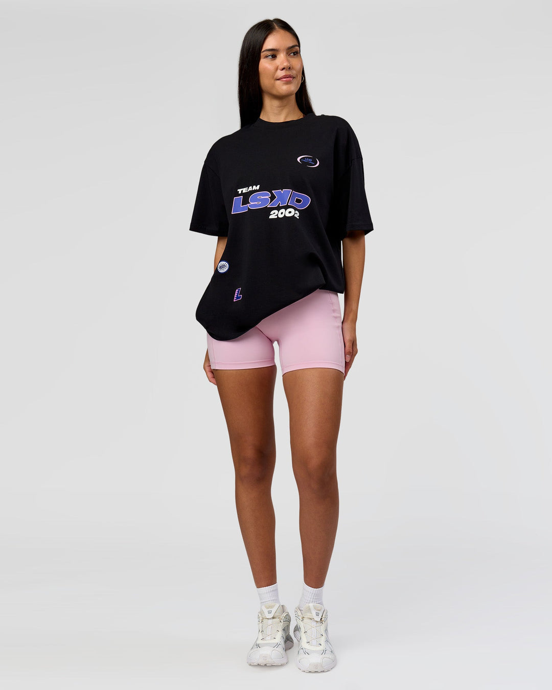 Woman wearing League Heavyweight FLXCotton Oversized Tee - Black-Power Cobalt | Model:Rhiley | Size:XS - view 5