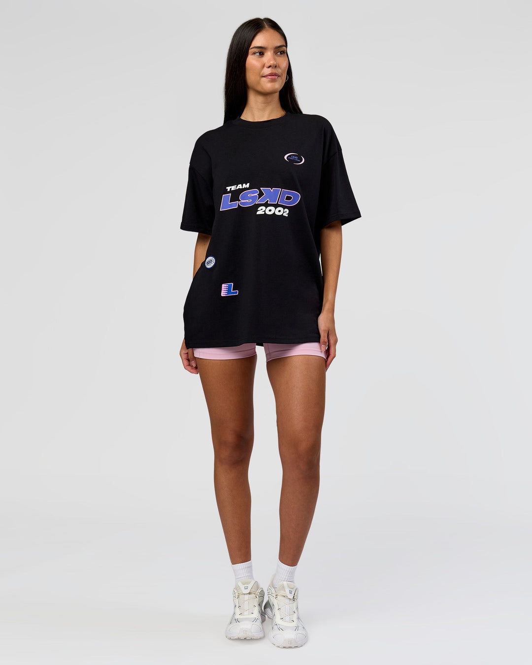 Woman wearing League Heavyweight FLXCotton Oversized Tee - Black-Power Cobalt | Model:Rhiley | Size:XS - view 9