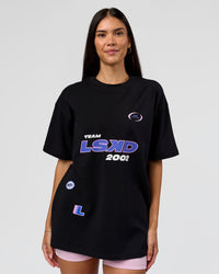 Woman wearing League Heavyweight FLXCotton Oversized Tee - Black-Power Cobalt | Model:Rhiley | Size:XS | Thumbnail Index: 5