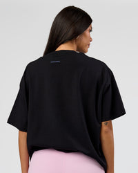 Woman wearing League Heavyweight FLXCotton Oversized Tee - Black-Power Cobalt | Model:Rhiley | Size:XS | Thumbnail Index: 14