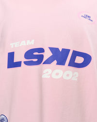 Woman wearing League Heavyweight FLXCotton Oversized Tee - Marshmallow-Power Cobalt | Model:Rhiley | Size:XS | Thumbnail Index: 14