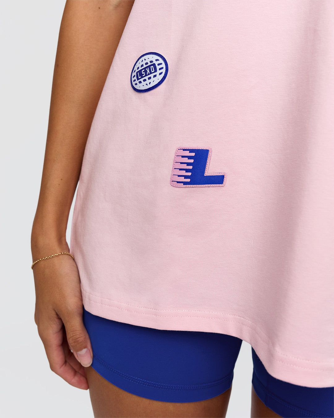 Woman wearing League Heavyweight FLXCotton Oversized Tee - Marshmallow-Power Cobalt | Model:Rhiley | Size:XS - view 7