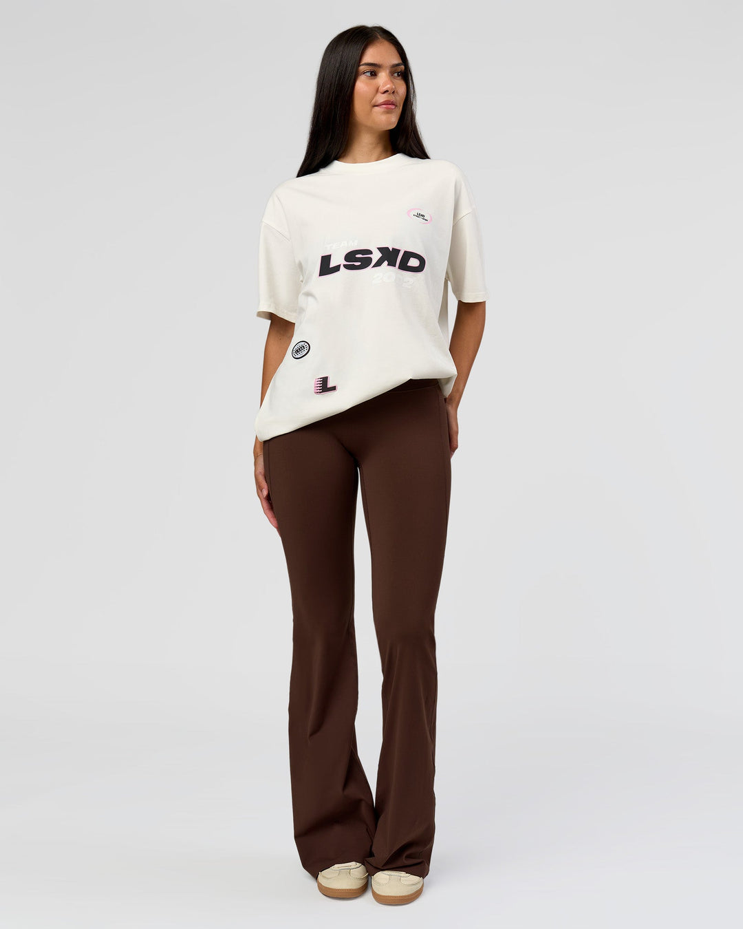 Woman wearing League Heavyweight FLXCotton Oversized Tee - Off White-Ground Coffee | Model:Rhiley | Size:XS - view 6