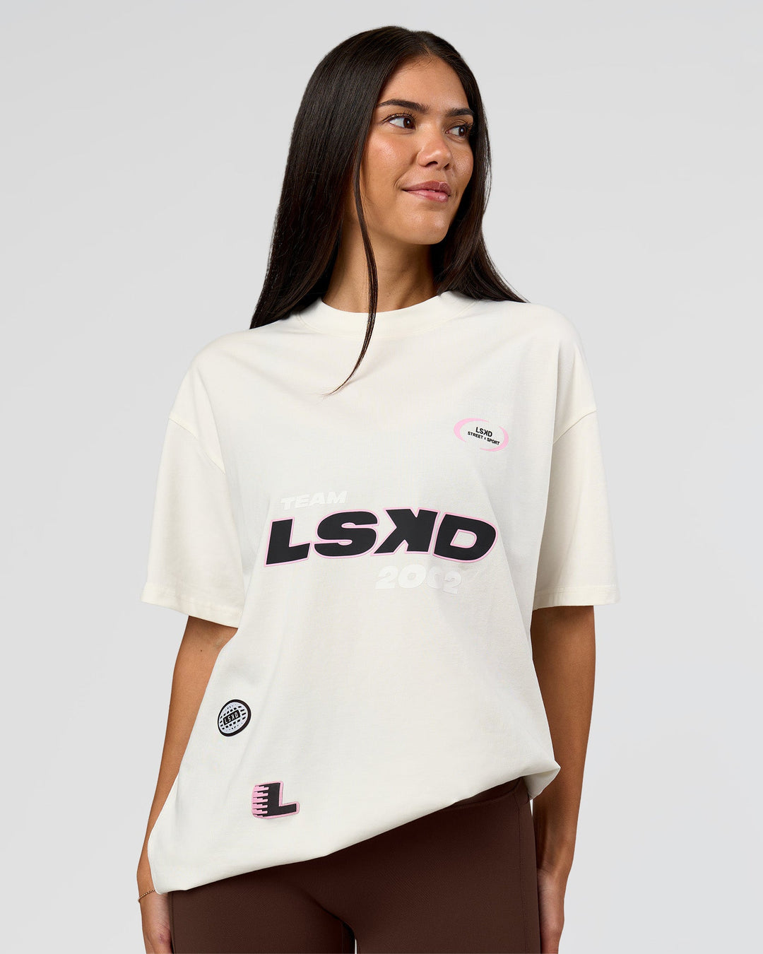Woman wearing League Heavyweight FLXCotton Oversized Tee - Off White-Ground Coffee | Model:Rhiley | Size:XS - view 11