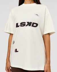 Woman wearing League Heavyweight FLXCotton Oversized Tee - Off White-Ground Coffee | Model:Rhiley | Size:XS | Thumbnail Index: 1