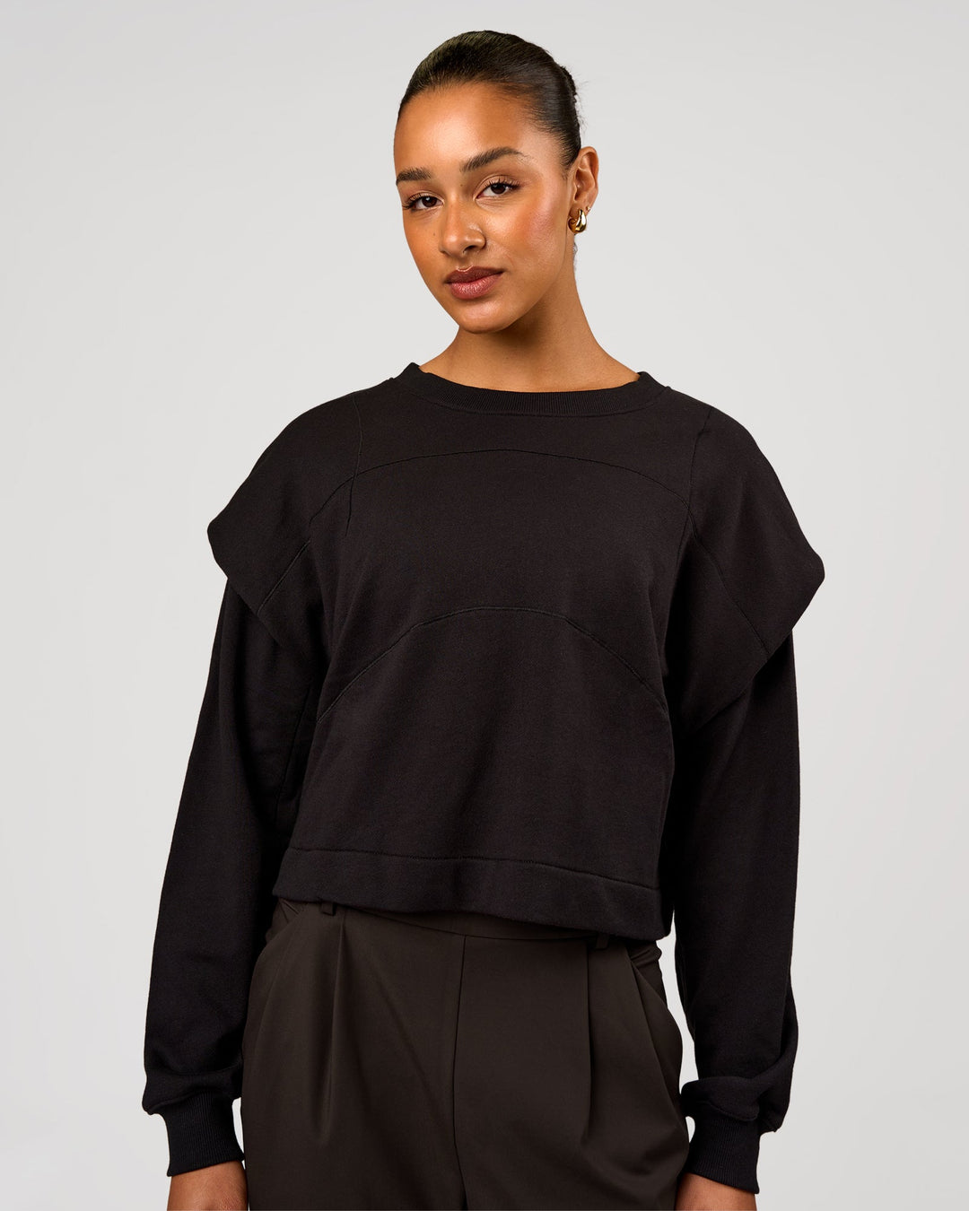 Woman wearing Bend Pleated Shoulder Oversized Sweat - Black | Model:Rosie | Size:XS - view 2