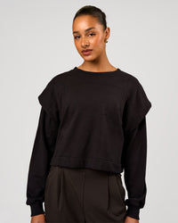 Woman wearing Bend Pleated Shoulder Oversized Sweat - Black | Model:Rosie | Size:XS | Thumbnail Index: 1