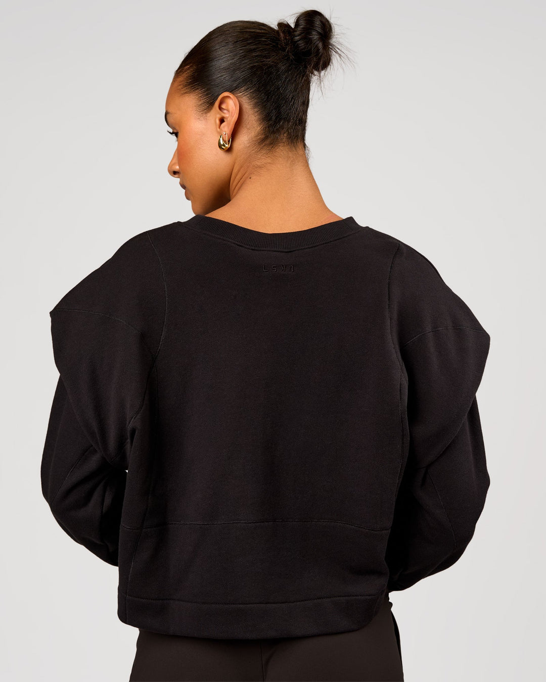 Woman wearing Bend Pleated Shoulder Oversized Sweat - Black | Model:Rosie | Size:XS - view 3