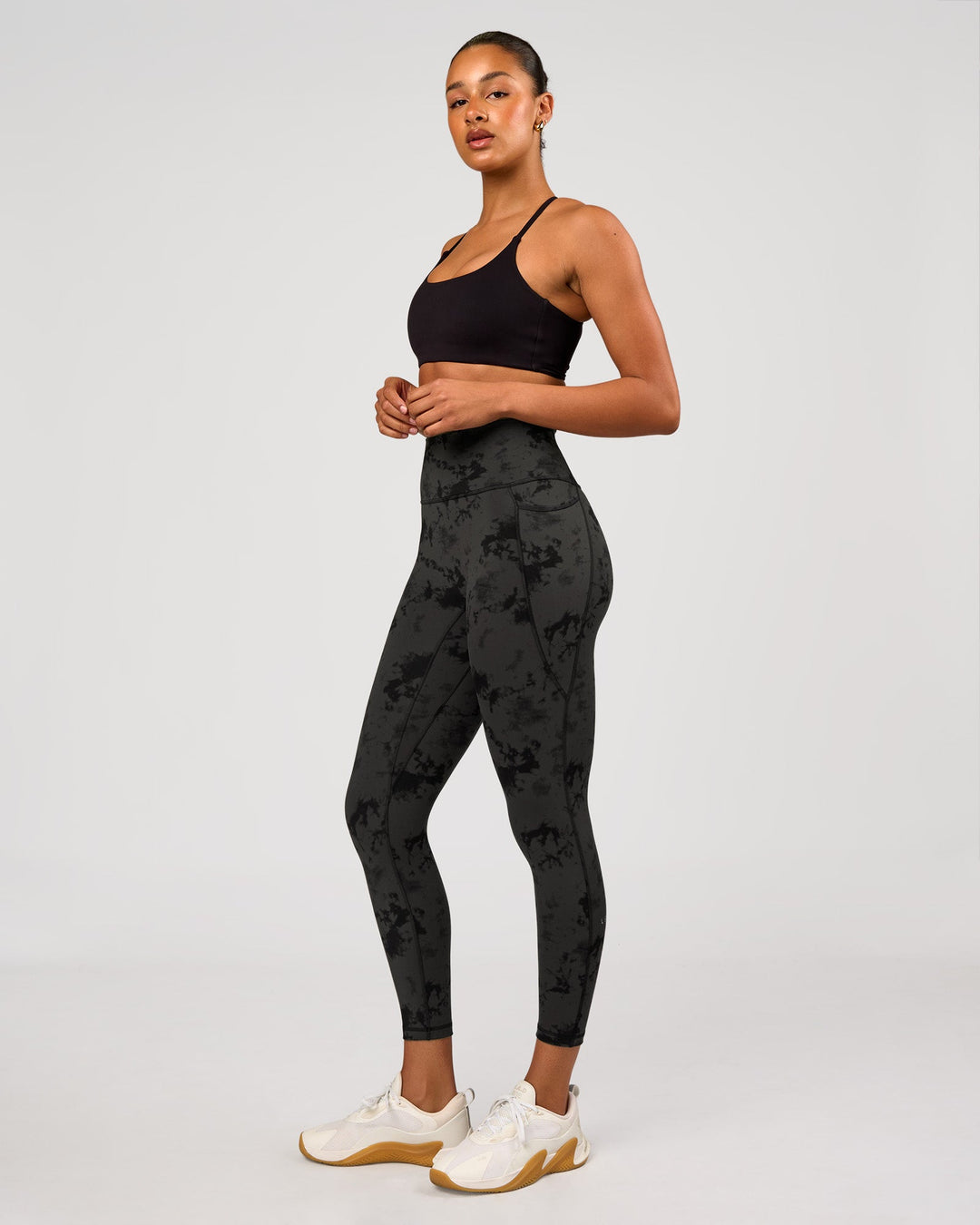 Woman wearing Fusion Ultra High-Rise 7/8 Legging Pockets - Obsidian/Black Tye Dye | Model:Rosie | Size:XS - view 3
