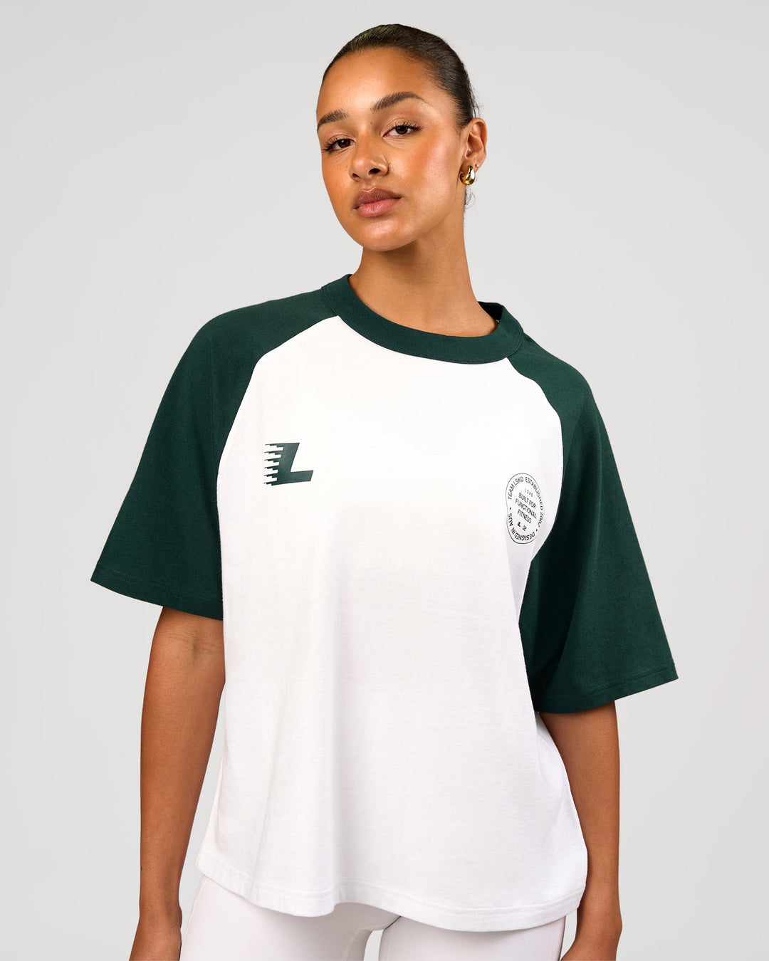 Woman wearing Victory Heavyweight Boxed Raglan Tee - White-Midnight Green | Model:Rosie | Size:XS - view 3