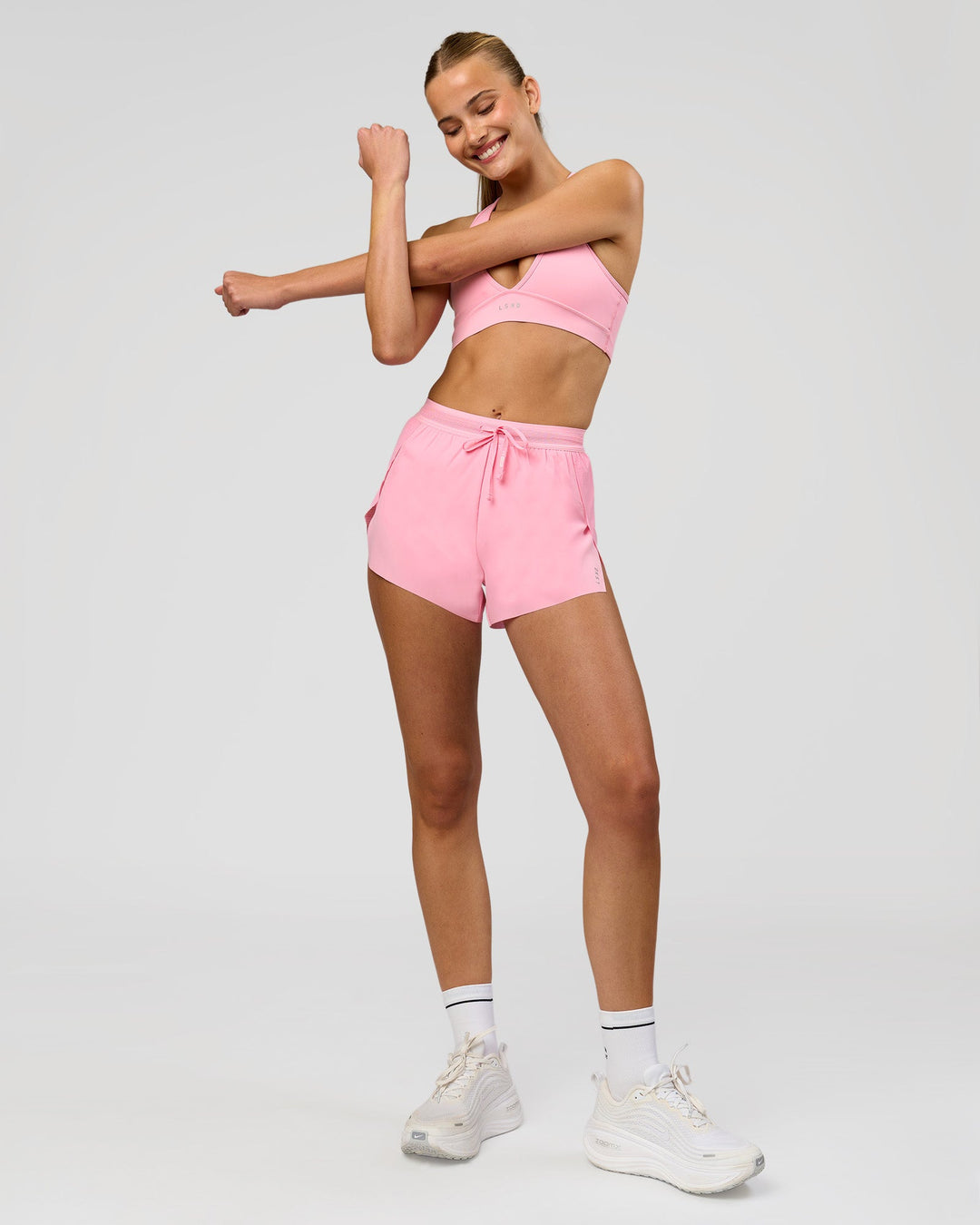 Woman wearing Accelerate 3" High-Rise Running Short - Pink Rose | Model:Taneisha | Size:XS - view 2