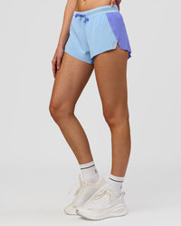 Woman wearing Accelerate 3" Mid-Rise Running Short - Bluebell-Open Air | Model:Taneisha | Size:XS | Thumbnail Index: 7