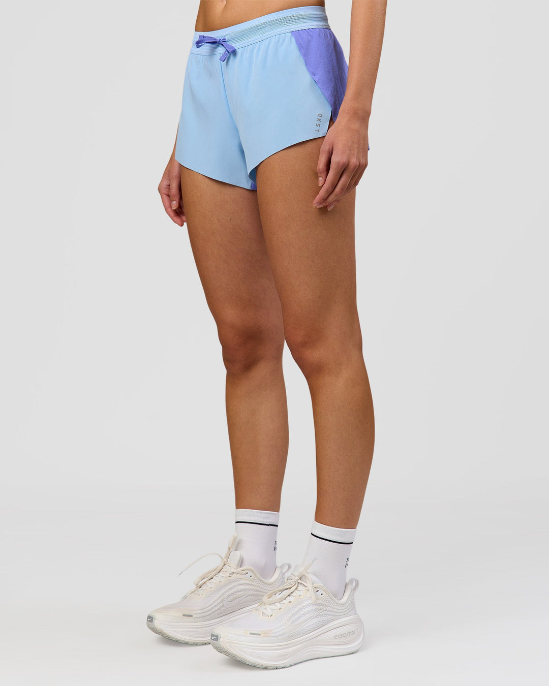 Woman wearing Accelerate 3" Mid-Rise Running Short - Bluebell-Open Air | Model:Taneisha | Size:XS - view 11