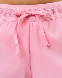 Woman wearing Accelerate 3" Mid-Rise Running Short - Pink Rose | Model:Taneisha | Size:XS
