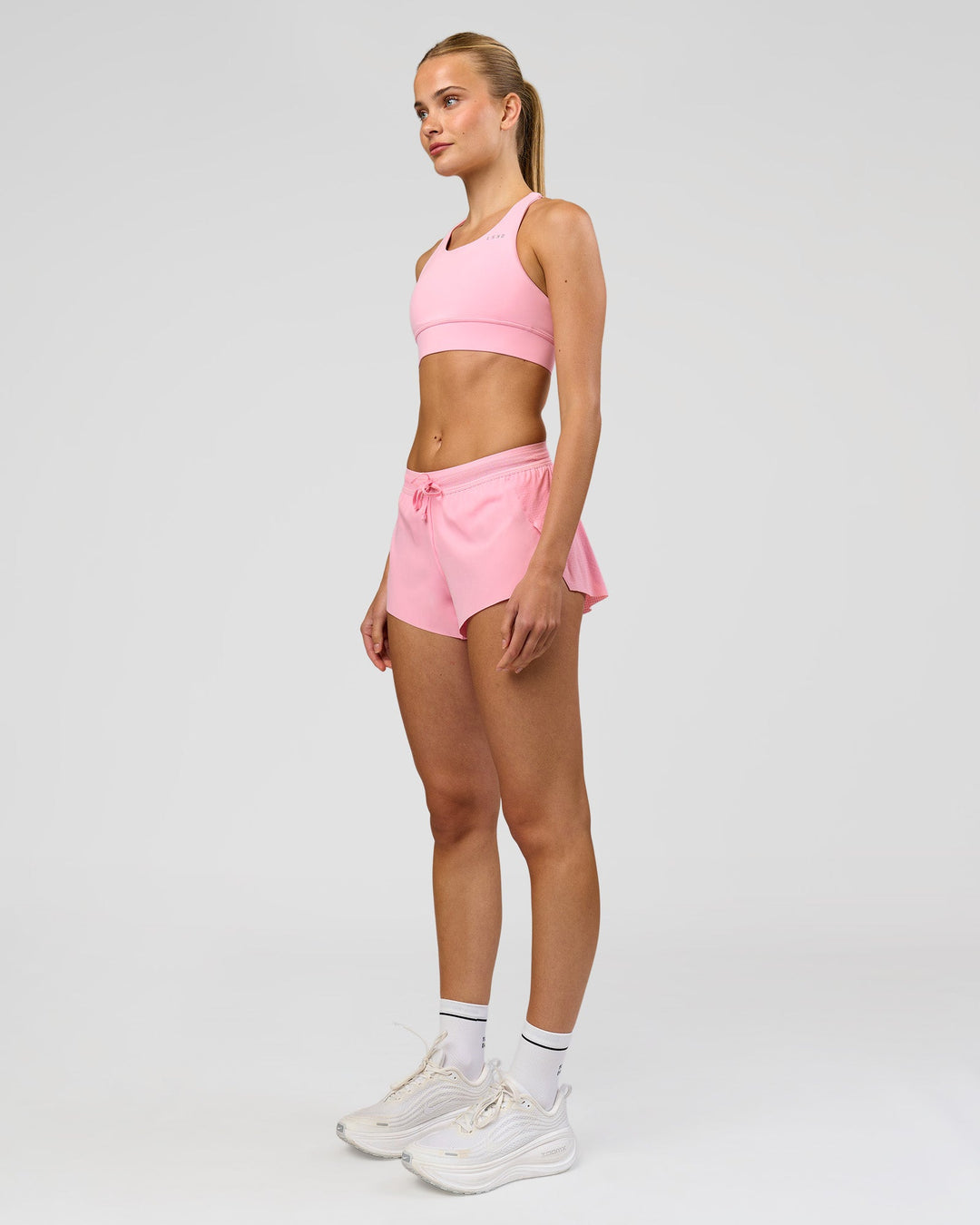 Woman wearing Accelerate 3" Mid-Rise Running Short - Pink Rose | Model:Taneisha | Size:XS