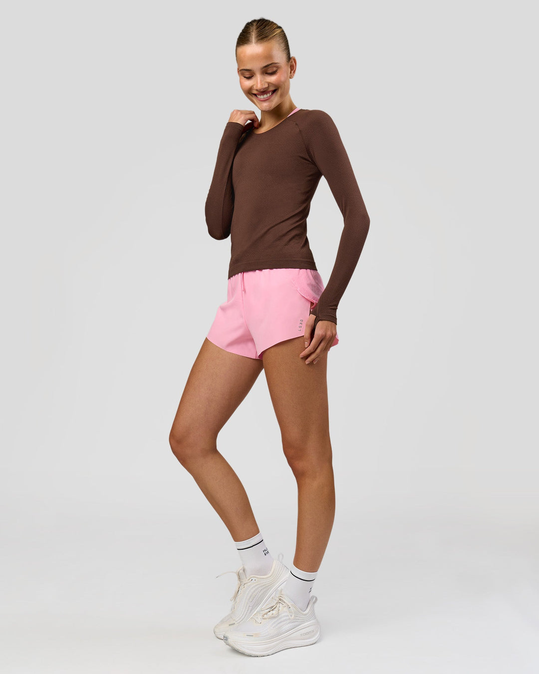 Woman wearing AeroFLX+ Seamless Long Sleeve Tee - Hot Chocolate/Hot Chocolate | Model:Taneisha | Size:XS - view 7