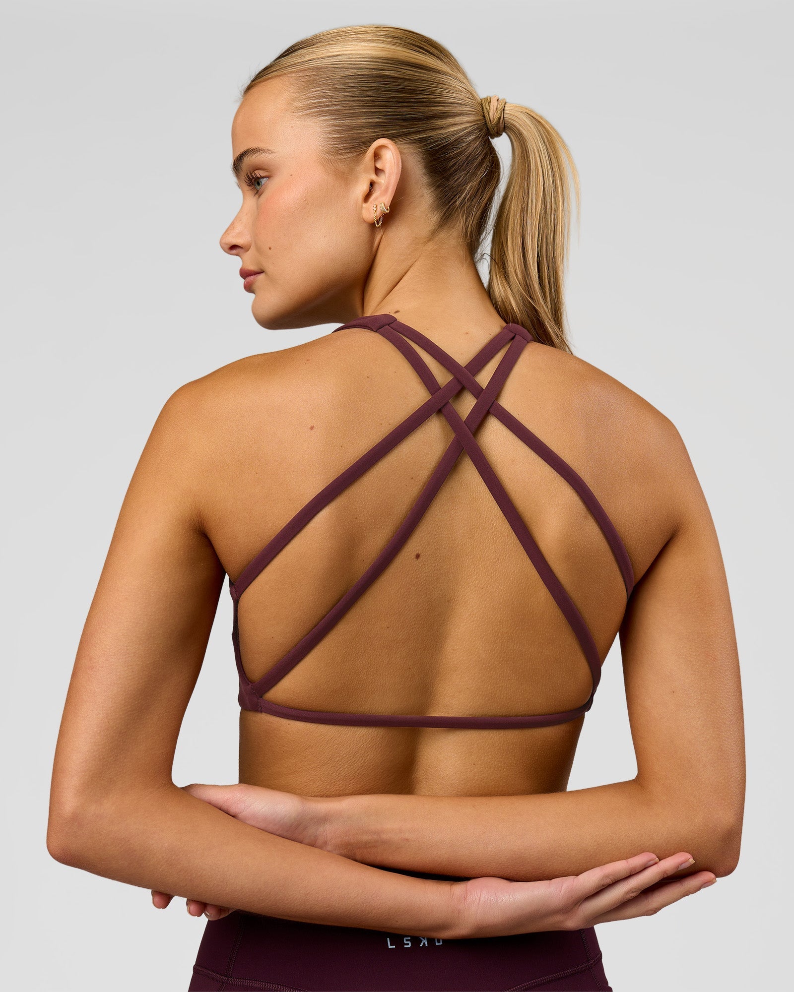 Woman wearing Aspire Sports Bra - Cherry Lacquer | Model:Taneisha | Size:XS