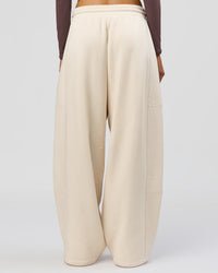 Woman wearing Bree Barrel Fleece Track Pant - Vanilla Bean | Model:Taneisha | Size:XS | Thumbnail Index: 4