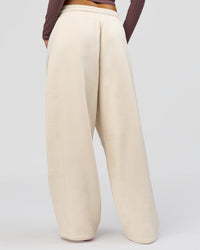 Woman wearing Bree Barrel Fleece Track Pant - Vanilla Bean | Model:Taneisha | Size:XS | Thumbnail Index: 8