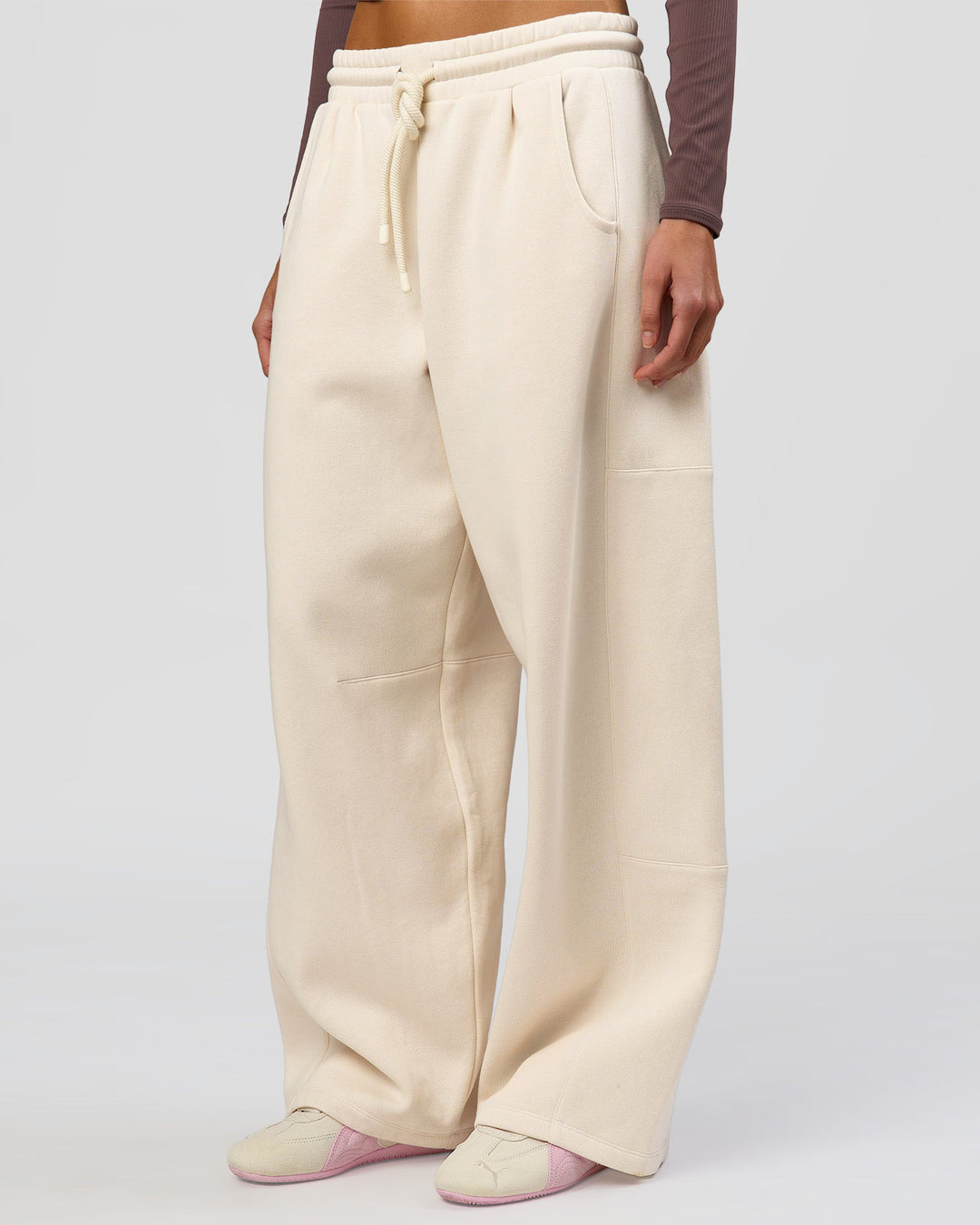 Woman wearing Bree Barrel Fleece Track Pant - Vanilla Bean | Model:Taneisha | Size:XS - view 6