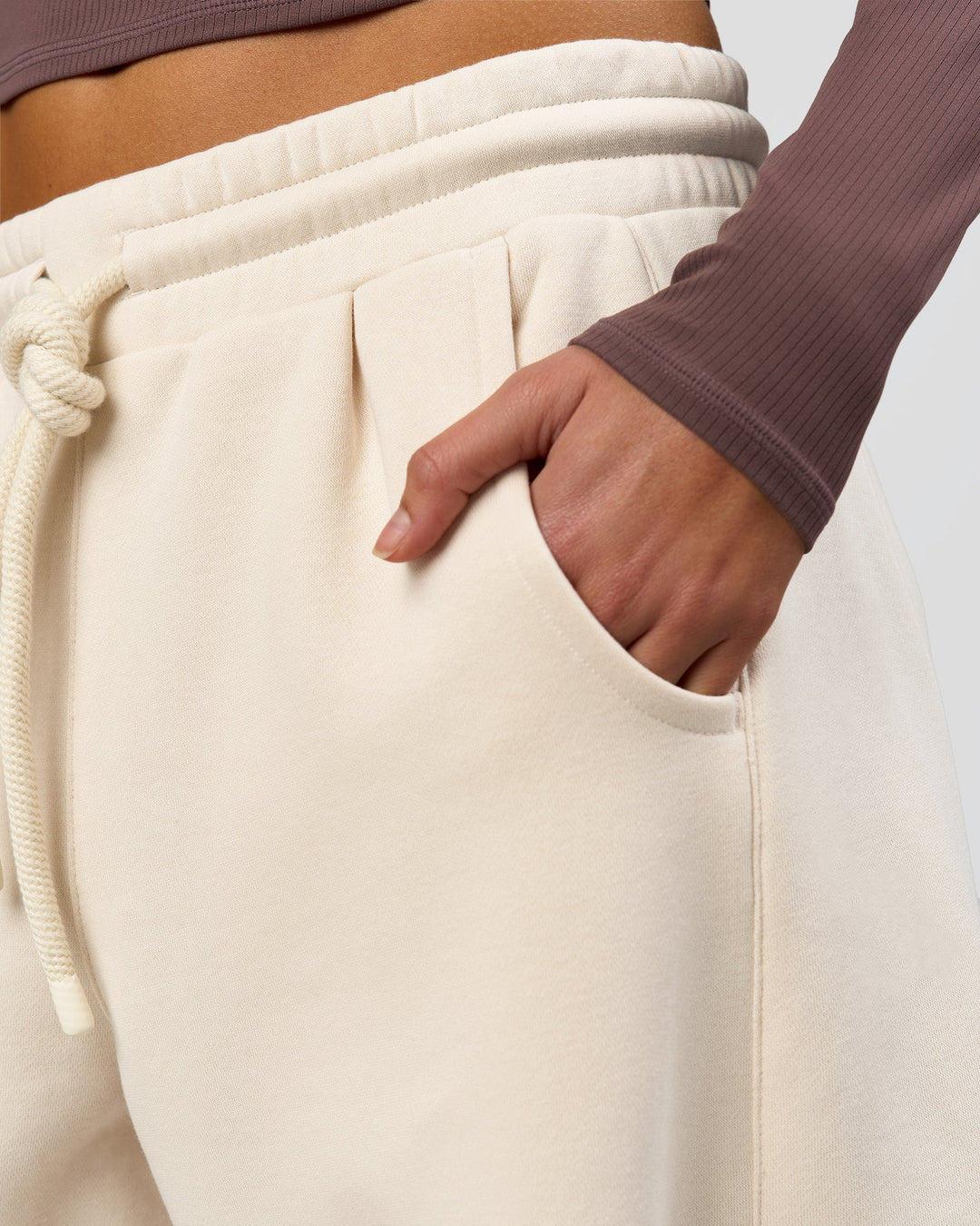Woman wearing Bree Barrel Fleece Track Pant - Vanilla Bean | Model:Taneisha | Size:XS - view 13