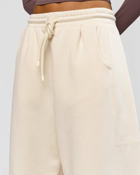Woman wearing Bree Barrel Fleece Track Pant - Vanilla Bean | Model:Taneisha | Size:XS | Thumbnail Index: 14