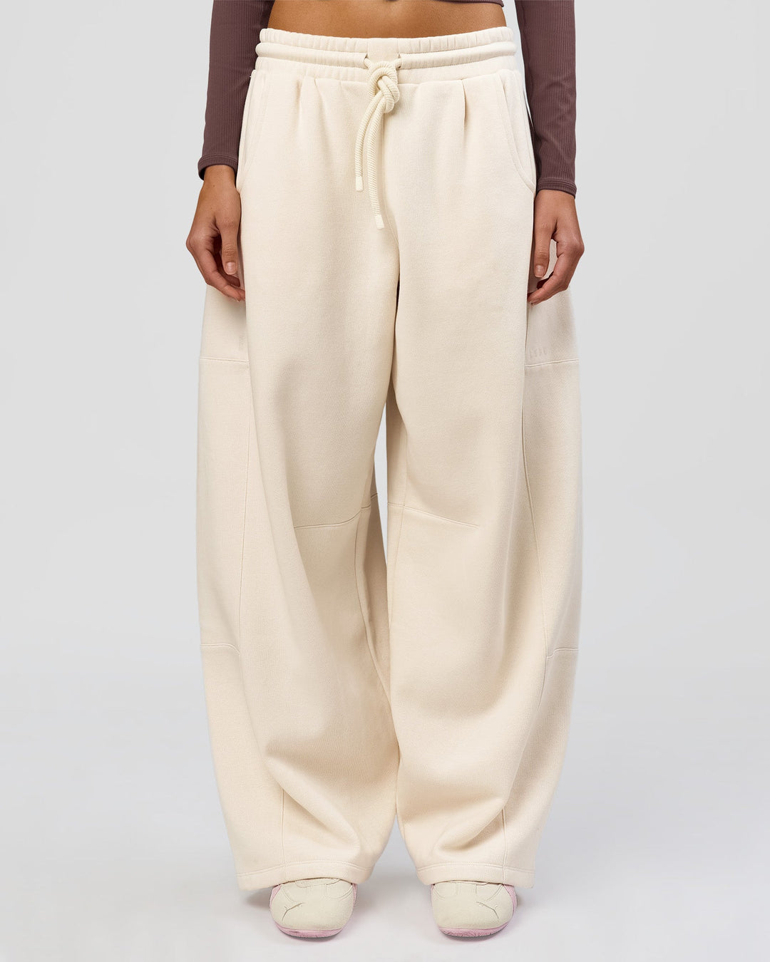 Woman wearing Bree Barrel Fleece Track Pant - Vanilla Bean | Model:Taneisha | Size:XS - view 2