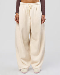Woman wearing Bree Barrel Fleece Track Pant - Vanilla Bean | Model:Taneisha | Size:XS | Thumbnail Index: 1