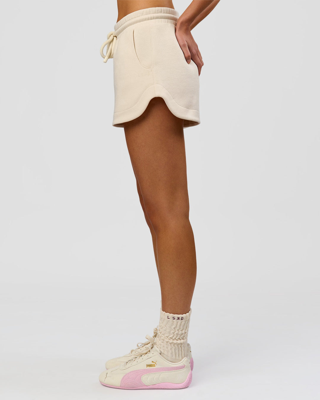 Woman wearing Bree Fleece Track Short - Vanilla Bean | Model:Taneisha | Size:XS - view 12