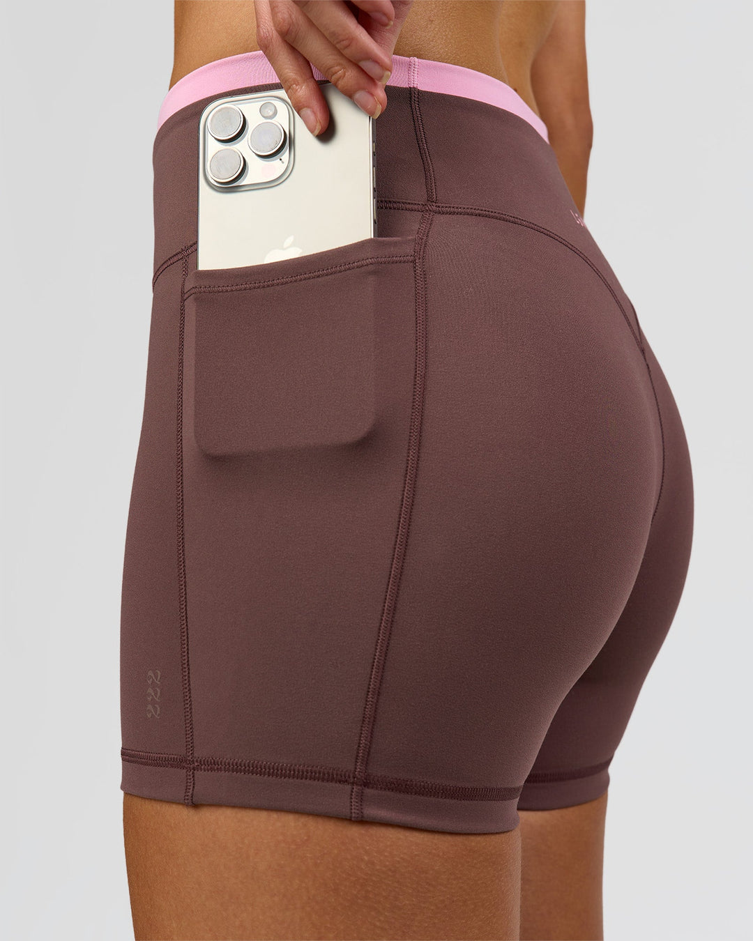 Woman wearing Bree Fusion High-Rise 4" Short Pockets - Cocoa Powder-Pink Rose | Model:Taneisha | Size:XS - view 2