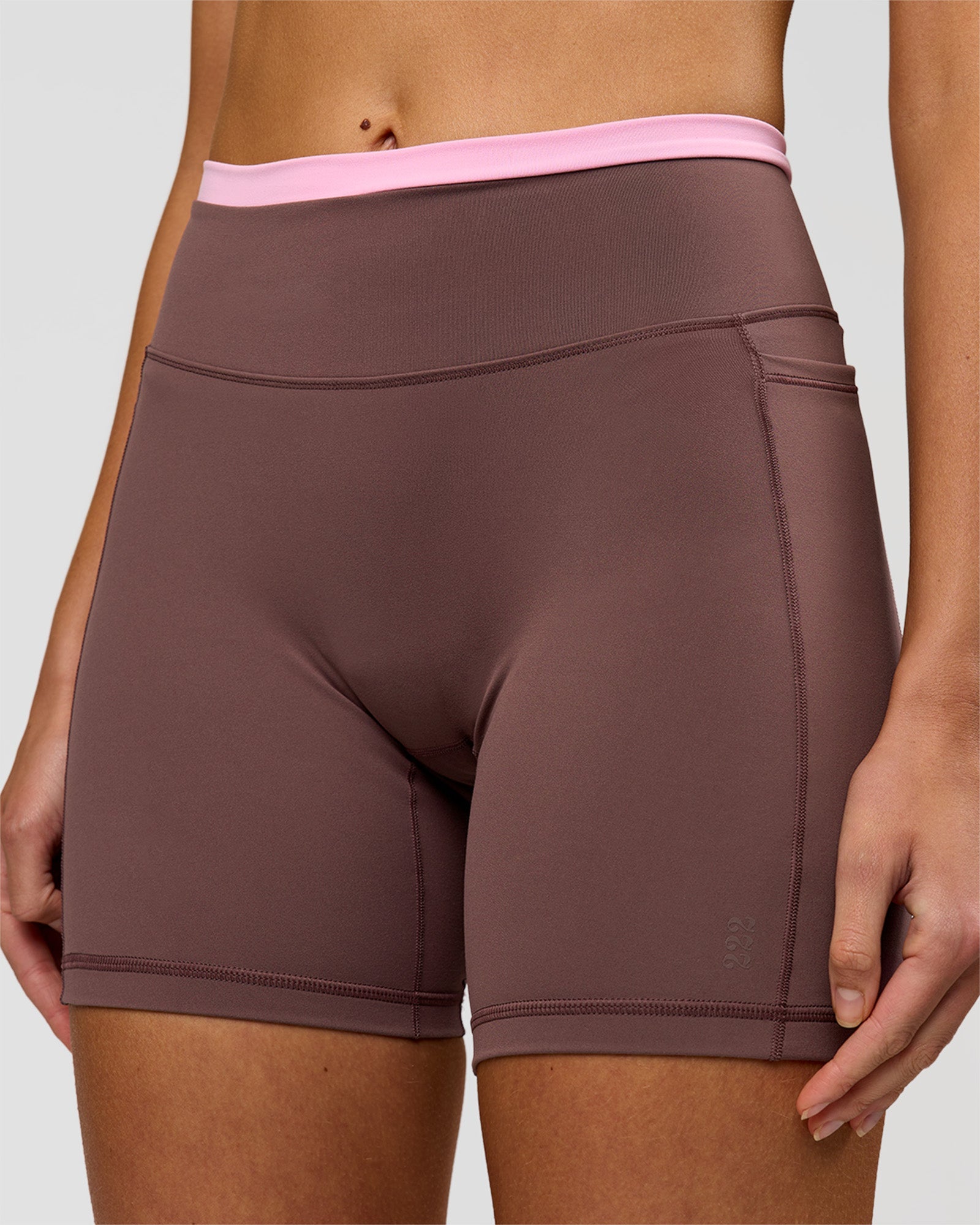 Woman wearing Bree Fusion High-Rise 6" Short Pockets - Cocoa Powder-Pink Rose | Model:Taneisha | Size:XS