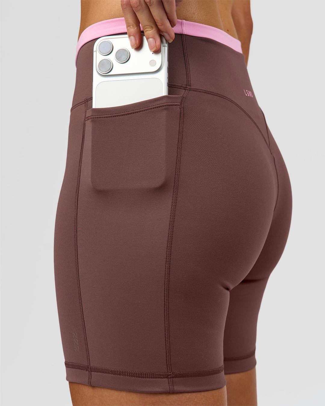 Woman wearing Bree Fusion High-Rise 6" Short Pockets - Cocoa Powder-Pink Rose | Model:Taneisha | Size:XS - view 11