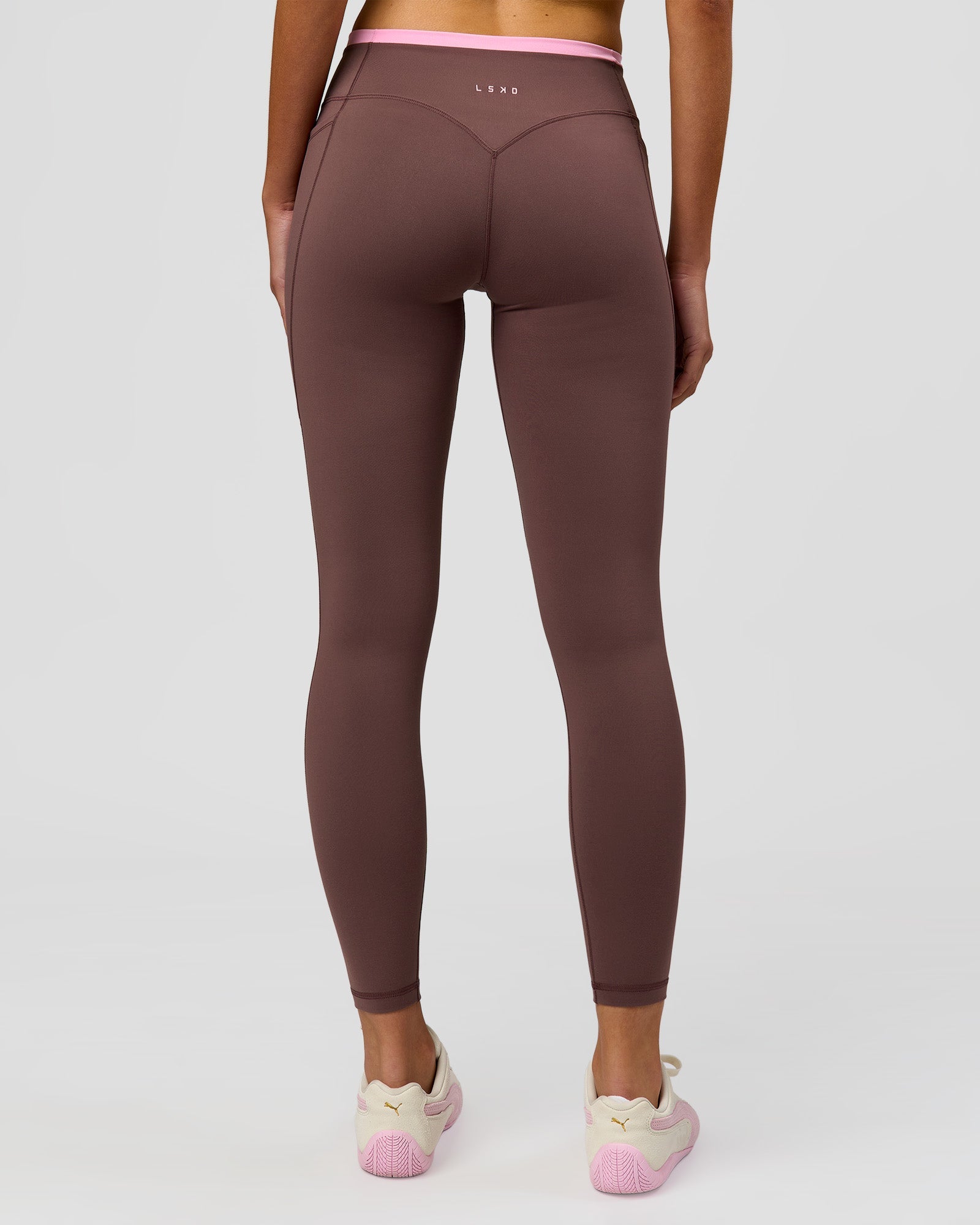 Woman wearing Bree Fusion High-Rise Full Length Legging Pockets - Cocoa Powder-Pink Rose | Model:Taneisha | Size:XS