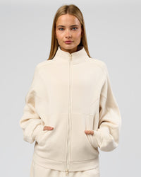 Woman wearing Bree Oversized Fleece Zip Thru - Vanilla Bean | Model:Taneisha | Size:XS | Thumbnail Index: 8