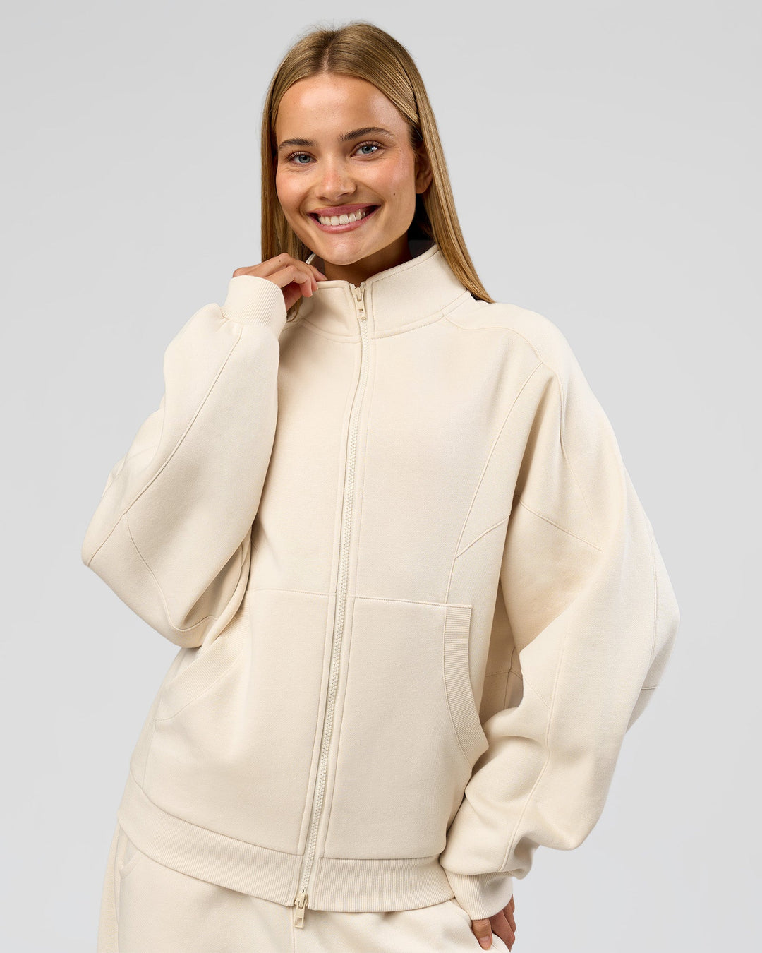 Woman wearing Bree Oversized Fleece Zip Thru - Vanilla Bean | Model:Taneisha | Size:XS - view 10