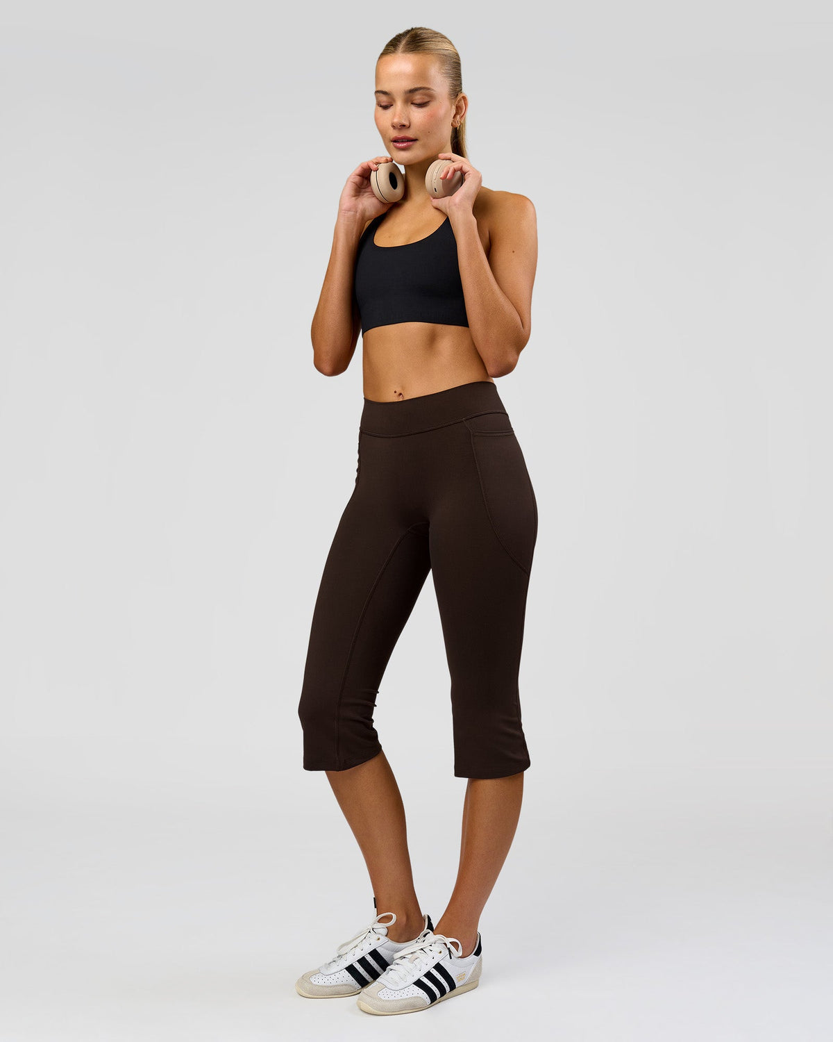 Woman wearing Deep V-Contour High-Rise Flared Capri - Ground Coffee | Model:Taneisha | Size:XS