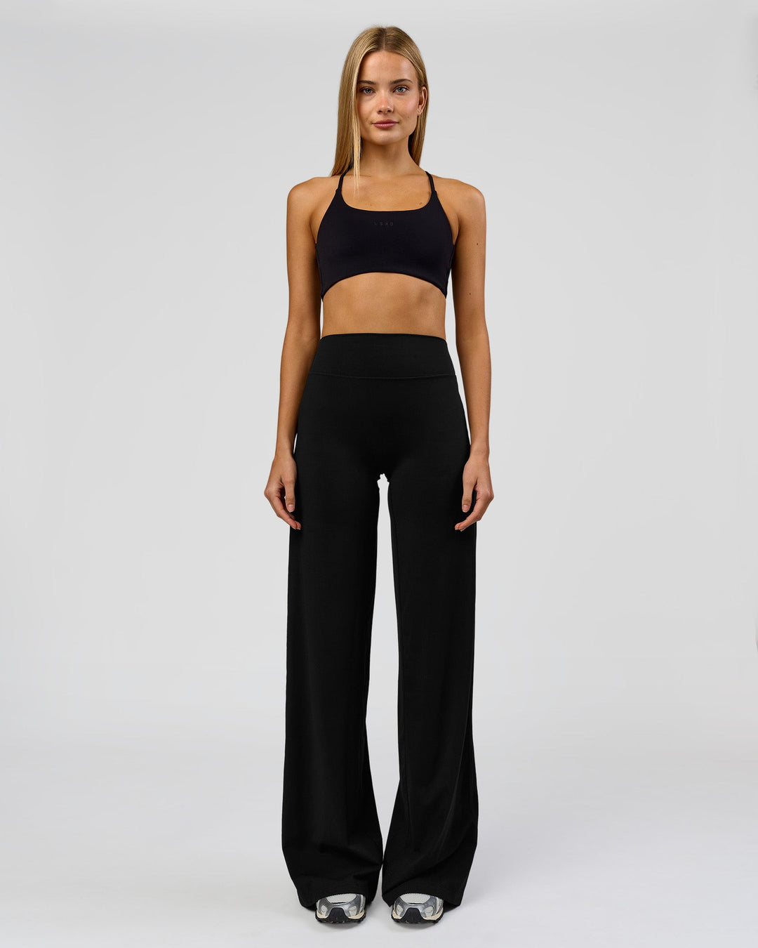 Woman wearing Elixir High-Rise Tall Pant - Black | Model:Taneisha | Size:XS - view 1