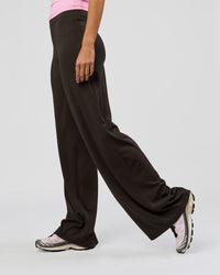 Woman wearing Elixir High-Rise Tall Pant - Ground Coffee | Model:Taneisha | Size:XS | Thumbnail Index: 1