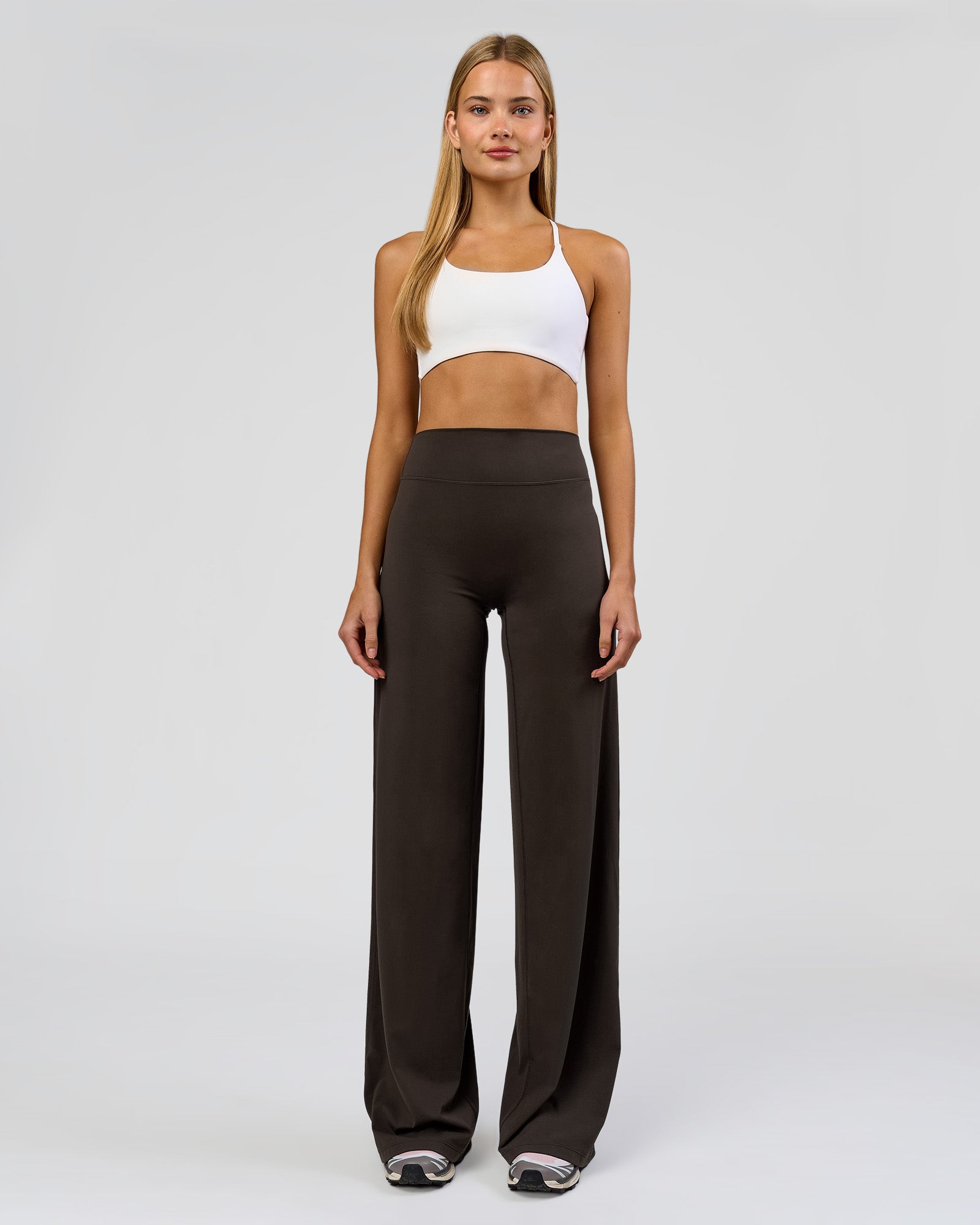 Woman wearing Elixir High-Rise Tall Pant - Ground Coffee | Model:Taneisha | Size:XS