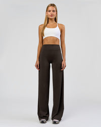 Woman wearing Elixir High-Rise Tall Pant - Ground Coffee | Model:Taneisha | Size:XS | Thumbnail Index: 0