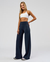 Woman wearing Elixir High-Rise Tall Pant - Midnight Navy | Model:Taneisha | Size:XS | Thumbnail Index: 4