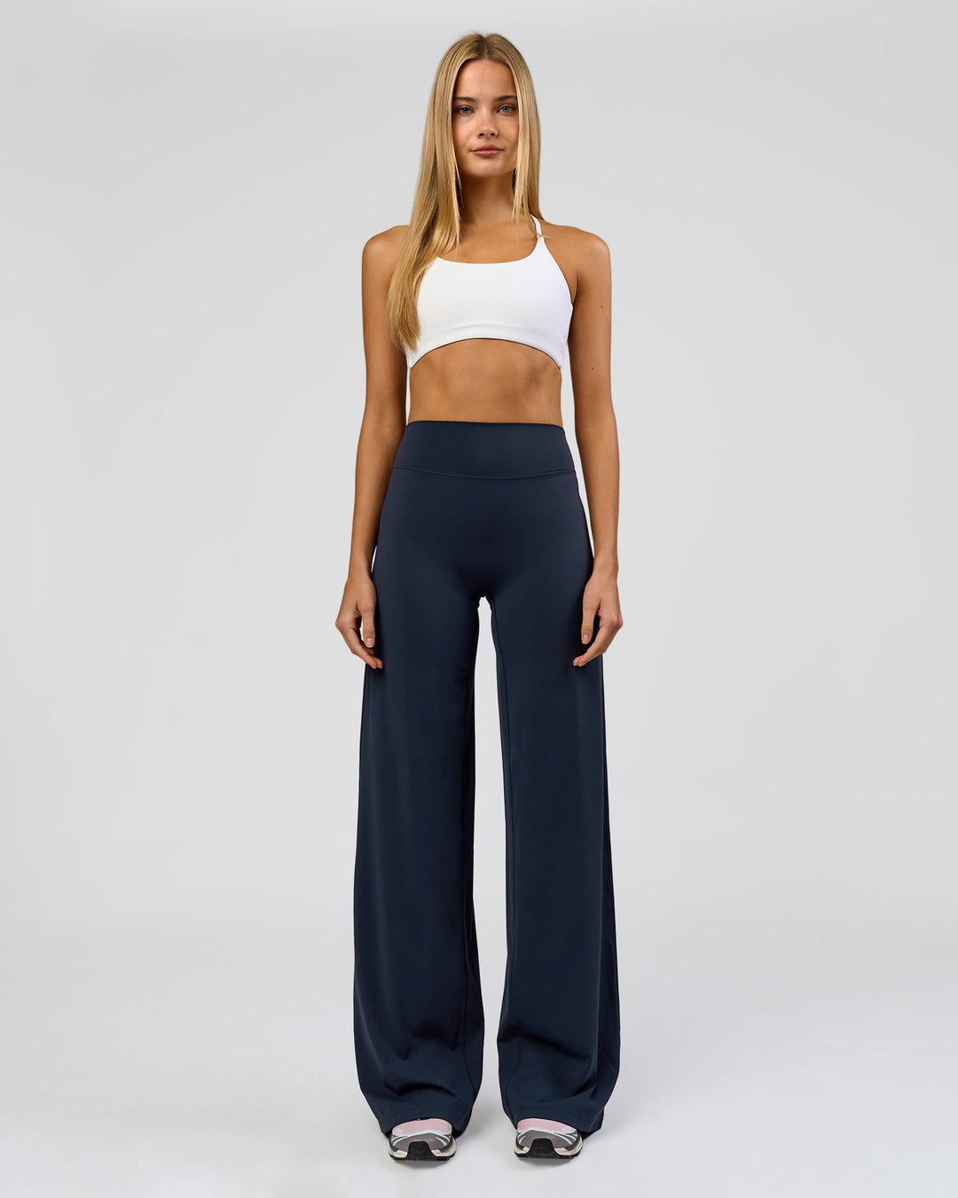 Woman wearing Elixir High-Rise Tall Pant - Midnight Navy | Model:Taneisha | Size:XS - view 1