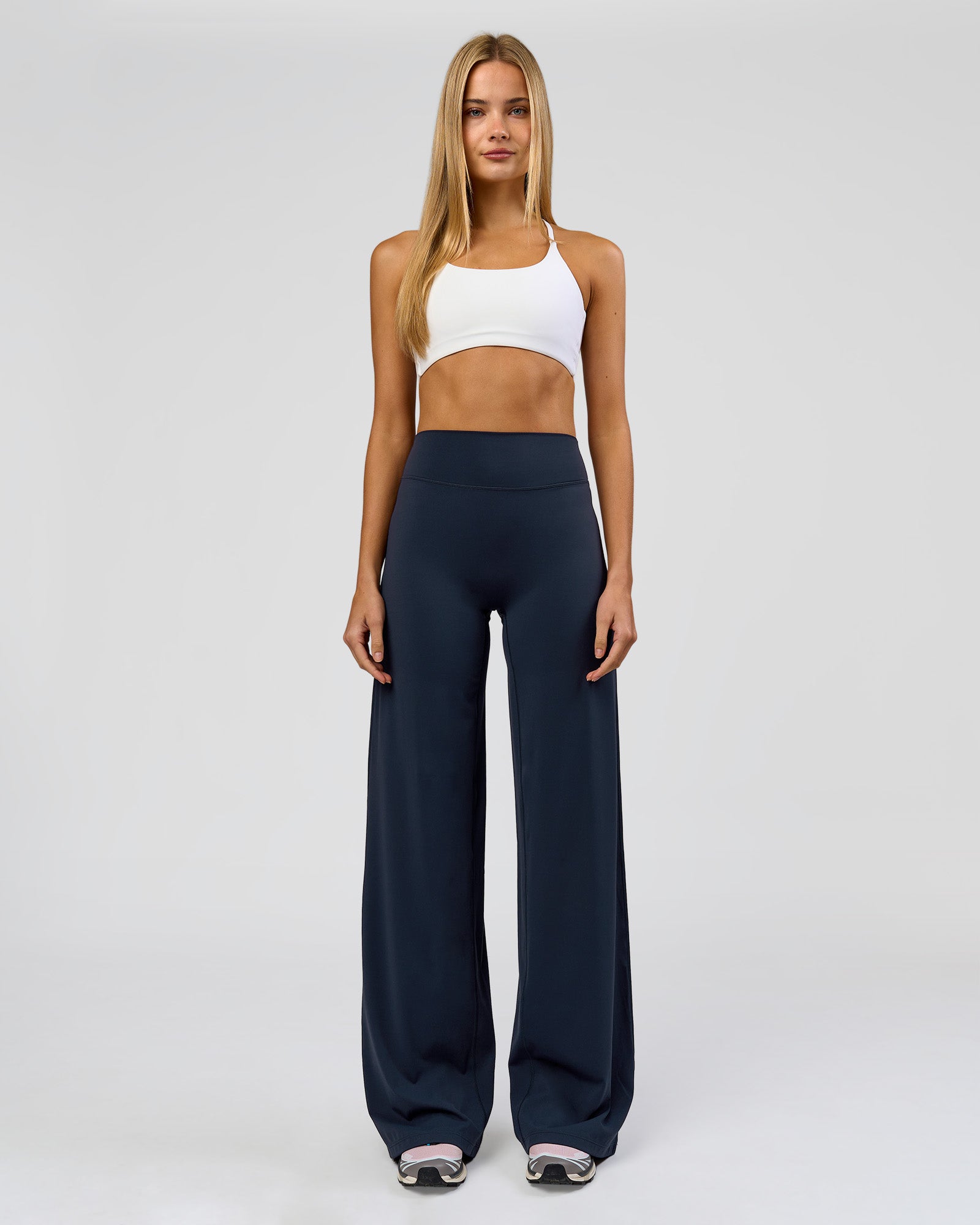 Woman wearing Elixir High-Rise Tall Pant - Midnight Navy | Model:Taneisha | Size:XS