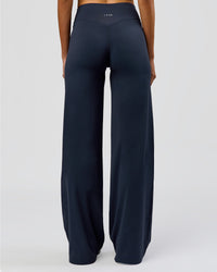 Woman wearing Elixir High-Rise Tall Pant - Midnight Navy | Model:Taneisha | Size:XS | Thumbnail Index: 3