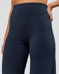 Woman wearing Elixir High-Rise Tall Pant - Midnight Navy | Model:Taneisha | Size:XS | Thumbnail Index: 6