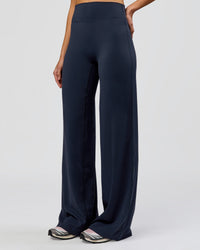 Woman wearing Elixir High-Rise Tall Pant - Midnight Navy | Model:Taneisha | Size:XS | Thumbnail Index: 2